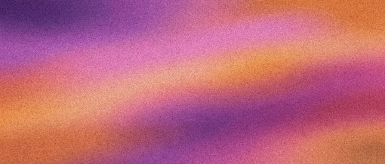 Smooth blurred gradient of violet, pink rose, and warm orange with fine film grain texture