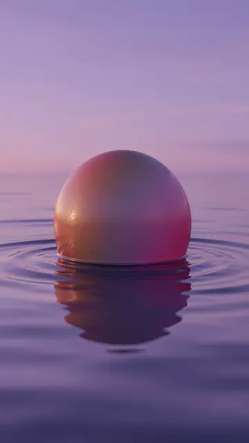 A smooth gradient sphere half-sits in calm rippled water beneath a lilac dusk sky with a soft reflection.