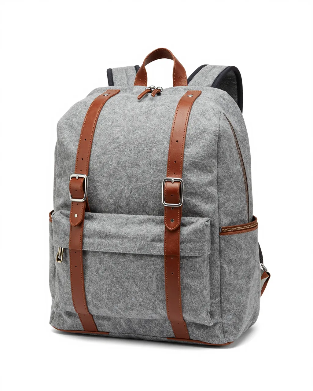 A gray canvas backpack with brown leather straps sits isolated on a plain white studio background.