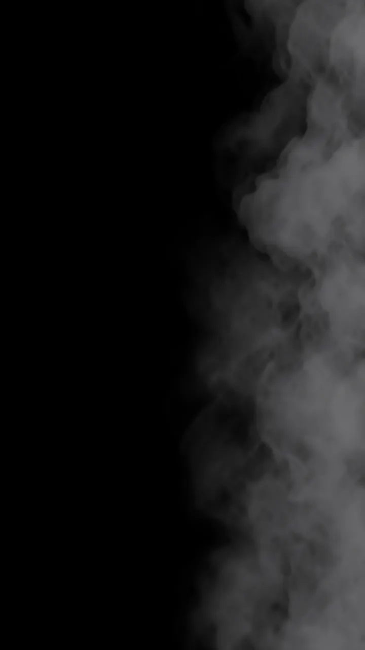 Soft gray mist and smoke drift in from the right edge of a solid pure black frame