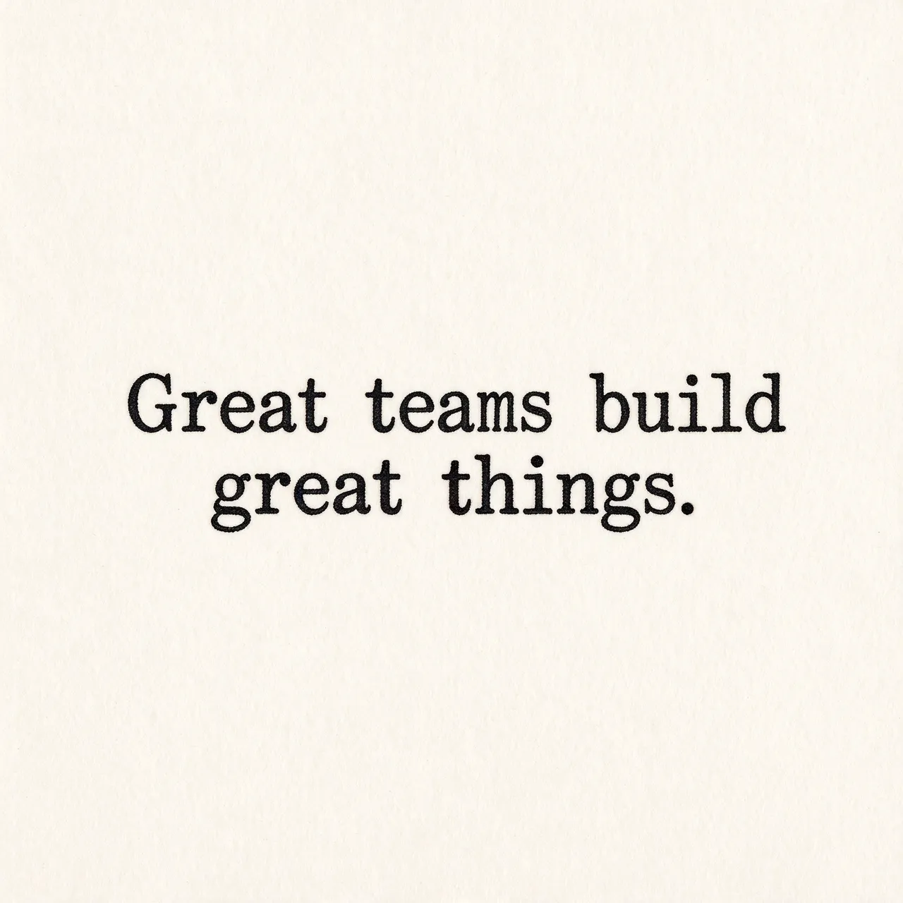 Typewriter-style text reading "Great teams build great things." centered on warm off-white textured paper