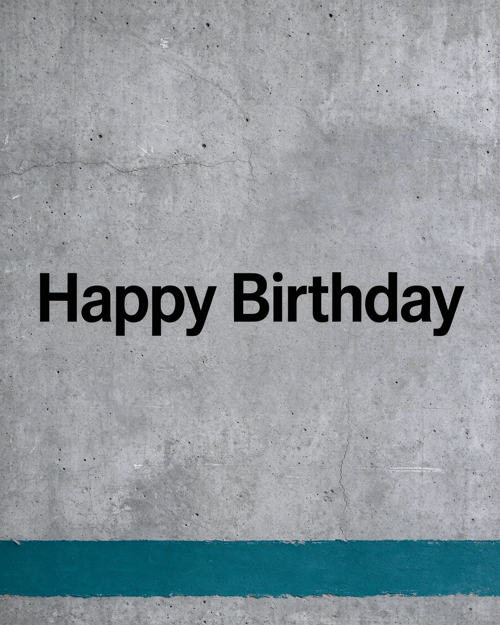 "Happy Birthday" in bold black sans-serif text centered on grey concrete with a teal paint stripe along the bottom