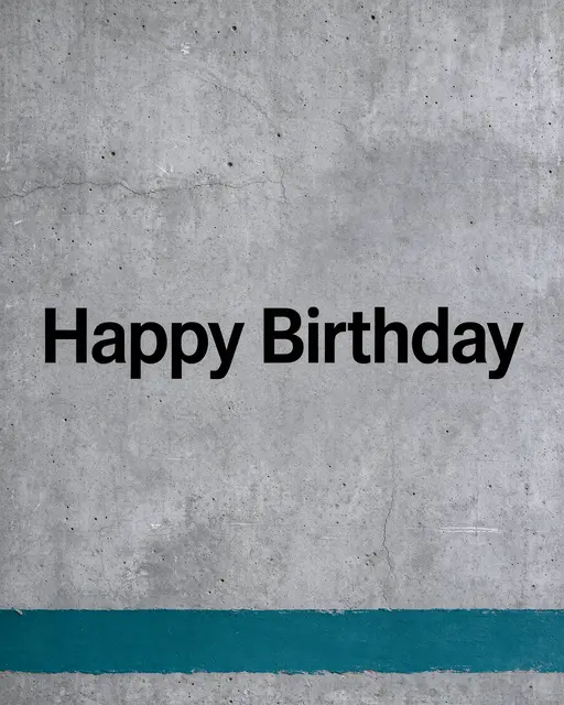 "Happy Birthday" in bold black sans-serif text centered on grey concrete with a teal paint stripe along the bottom