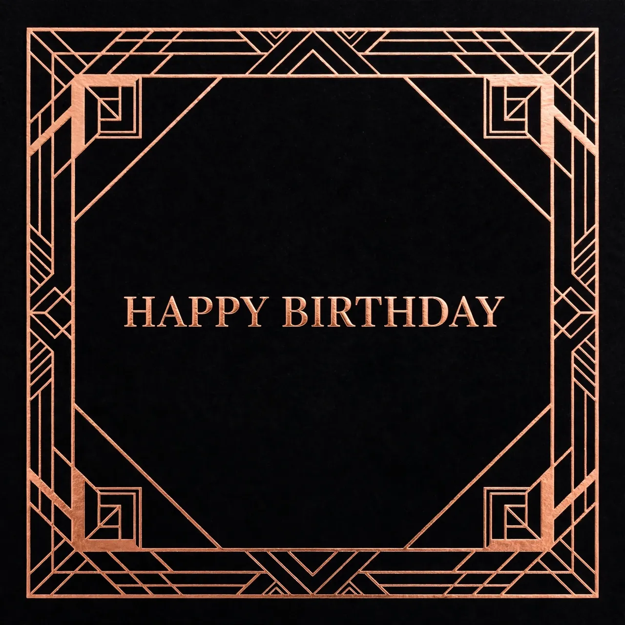 "Happy Birthday" in copper serif lettering centered inside a geometric copper foil art deco border on a solid black