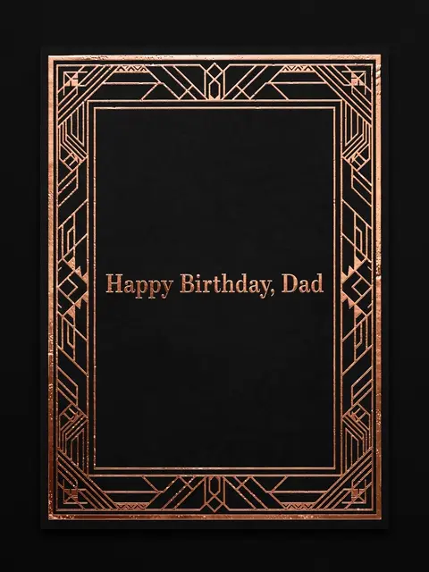 "Happy Birthday, Dad" in copper serif type centered on a black card with an art deco copper geometric border