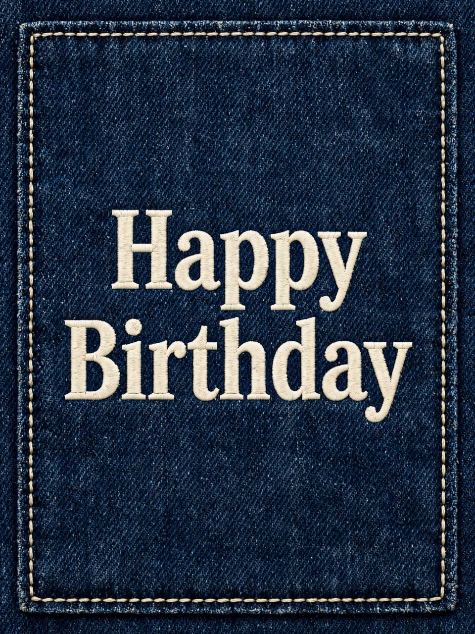 "Happy Birthday" embroidered in cream slab serif lettering on a stitched dark denim fabric background