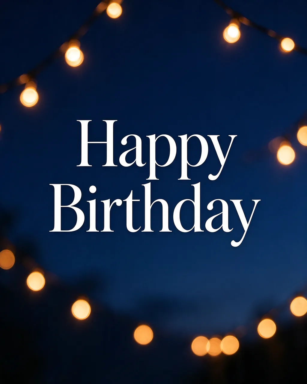 "Happy Birthday" in white serif text centered over soft warm bokeh string lights against a deep blue evening sky.