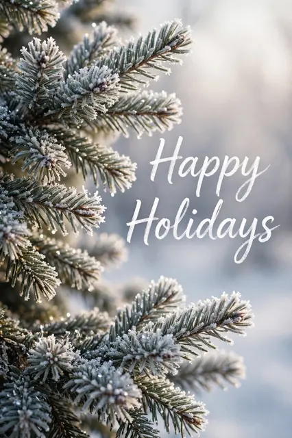 Frosted evergreen pine branches sit beside soft script text that reads "Happy Holidays" in gentle winter light.