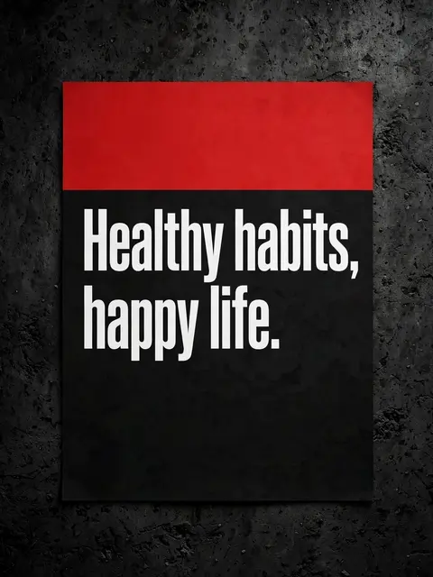 Poster with the quote "Healthy habits, happy life." mounted on a dark textured concrete wall