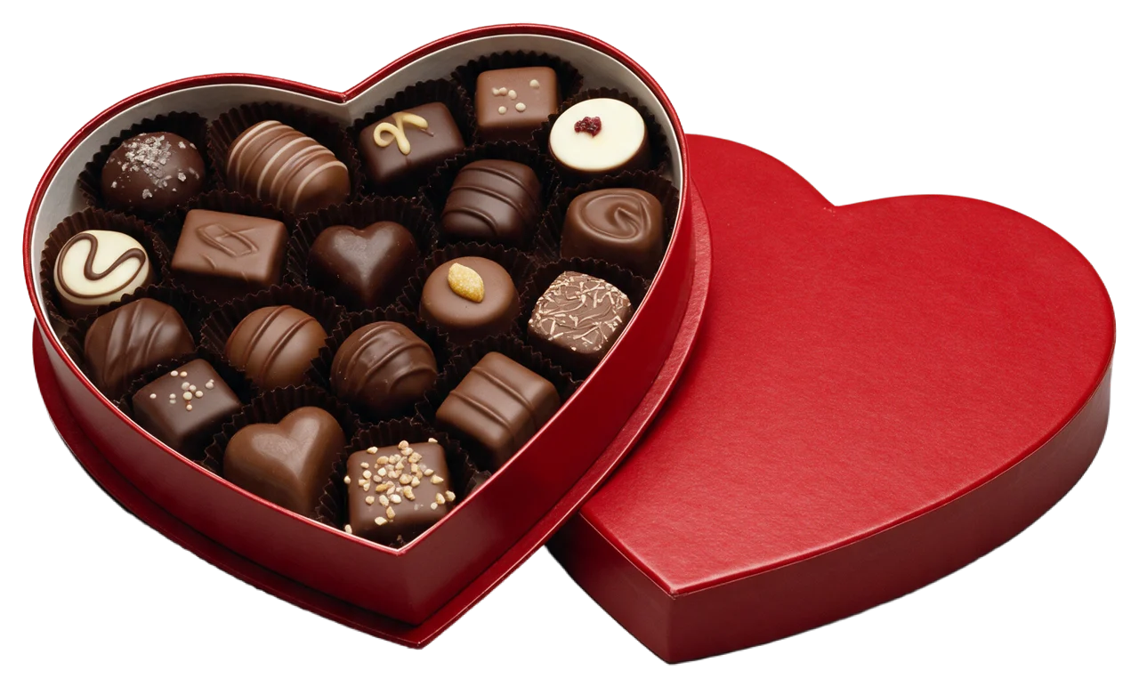 Open red heart-shaped box holding assorted decorated chocolates, lid resting beside it
