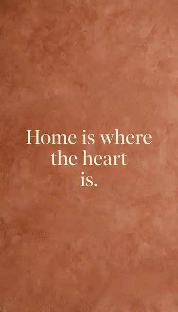 Cream serif text reading "Home is where the heart is." centered on a warm textured terracotta background.