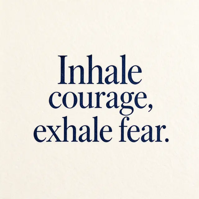 Letterpress print on cream cotton paper reading "Inhale courage, exhale fear." in deep navy ink