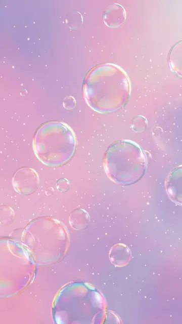 Glossy iridescent bubbles drift over a soft pink lilac haze dotted with tiny sparkling specks