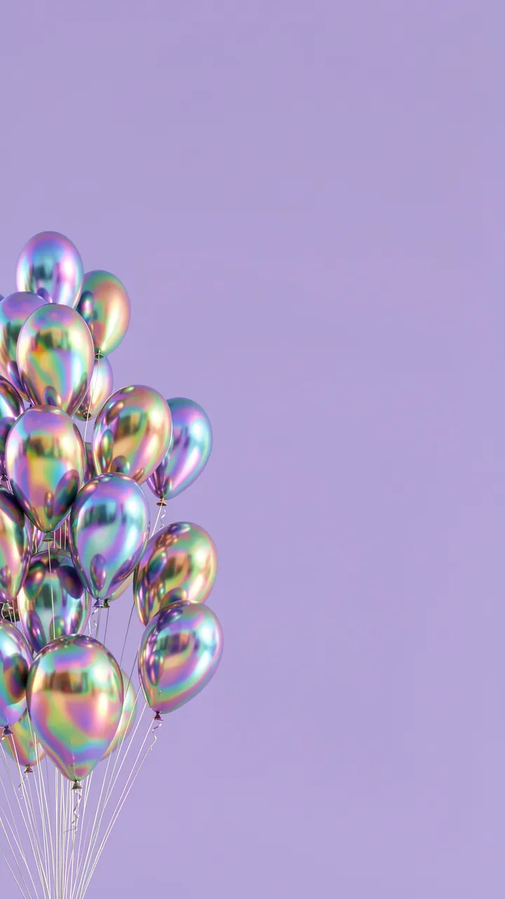 Bunch of iridescent metallic balloons rises against a solid lavender background with empty copy space.