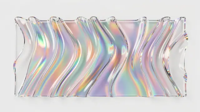 Wavy transparent glass displays soft rainbow refraction against a plain light gray background