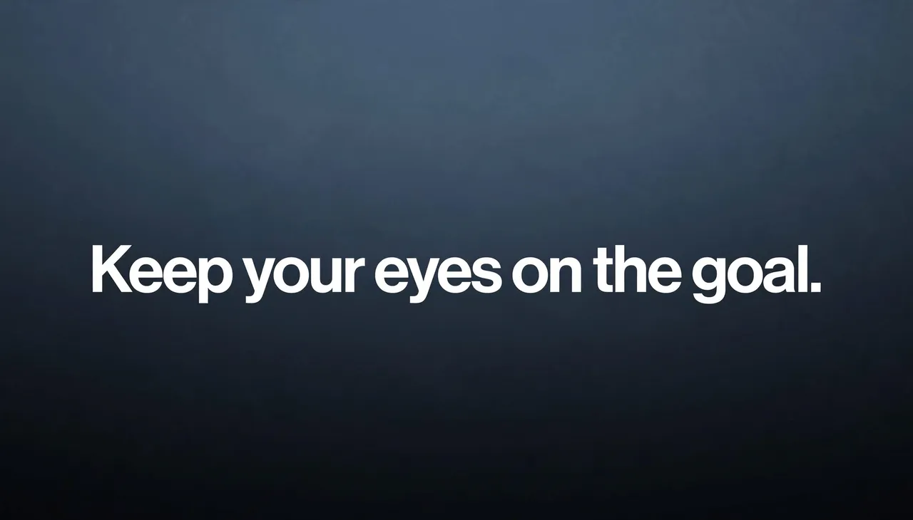 Bold white sans-serif text reading "Keep your eyes on the goal." centered on a dark slate gradient desktop wallpaper.