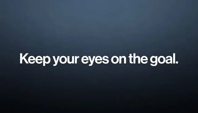 Bold white sans-serif text reading "Keep your eyes on the goal." centered on a dark slate gradient desktop wallpaper.