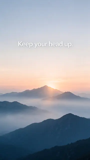 Misty layered mountain range at dawn with the quote "Keep your head up." over the soft gradient sky