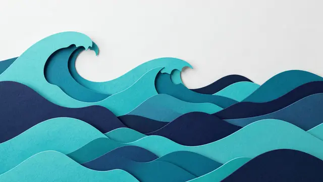 Layered paper cut ocean waves in aqua and navy sit against a pale neutral background