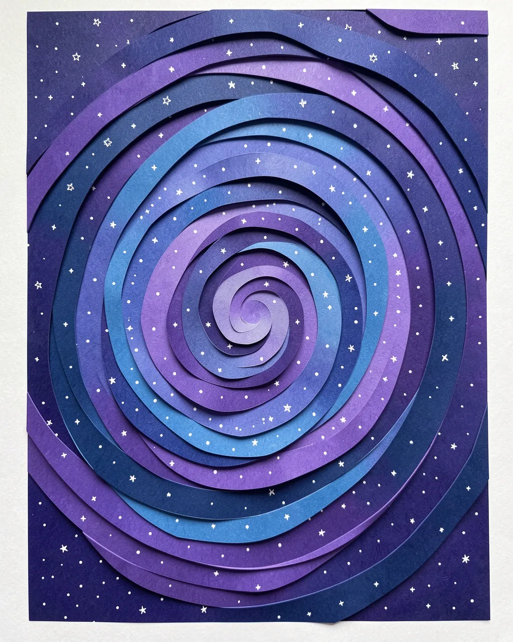 Layered paper cut art depicts a spiral galaxy in blue and violet shades dotted with tiny white stars