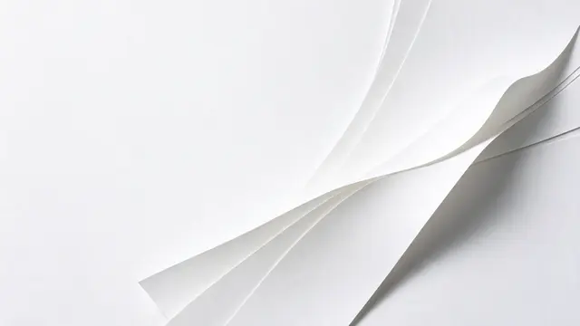 Layered curved white paper sheets sit on the right, with empty white copy space on the left.