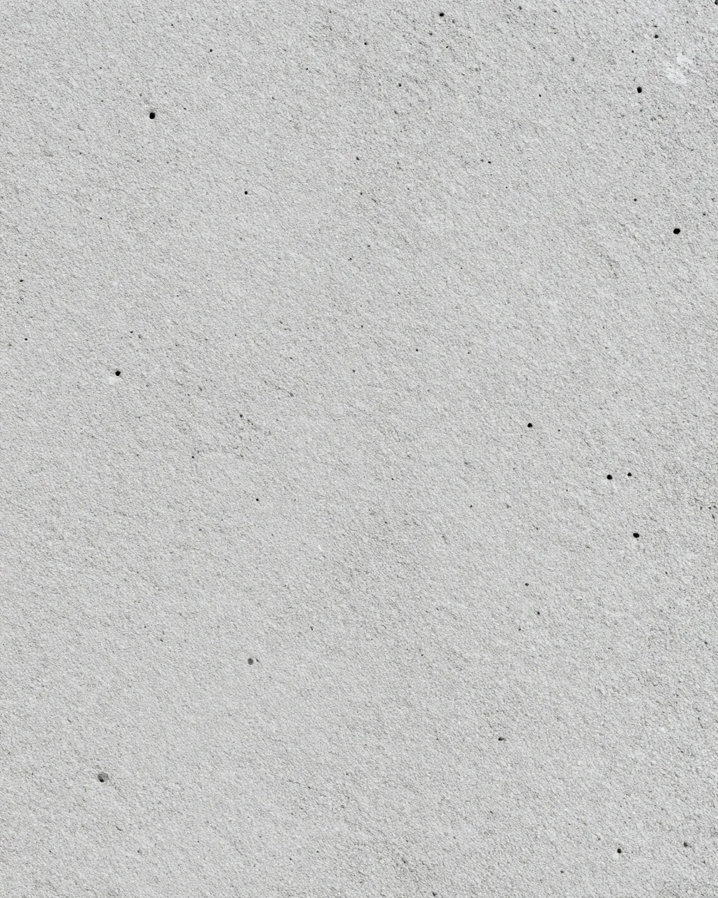 Full frame close-up of light gray porous pumice surface with even flat lighting