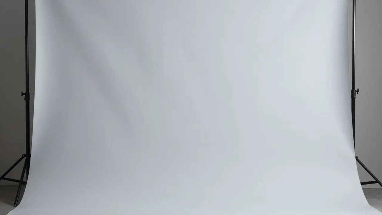 Smooth light gray studio backdrop mounted on black metal support stands with soft even lighting falloff