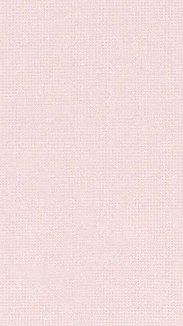 Full frame close-up of fine woven light pink linen fabric with even flat lighting