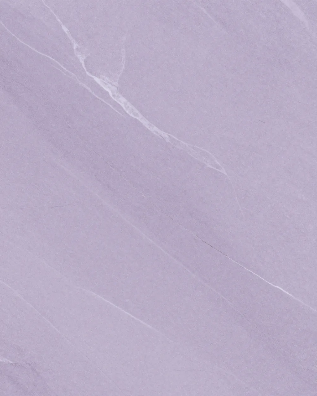 Full frame close-up of lilac marble with fine pale white and gray veining under flat even lighting