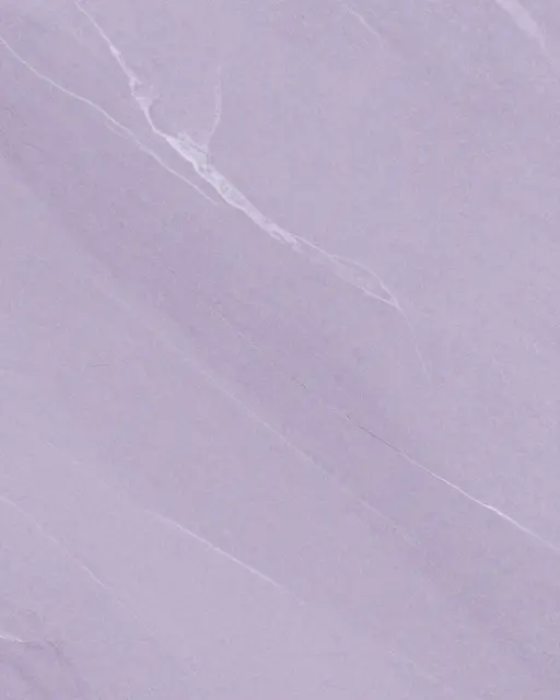 Full frame close-up of lilac marble with fine pale white and gray veining under flat even lighting