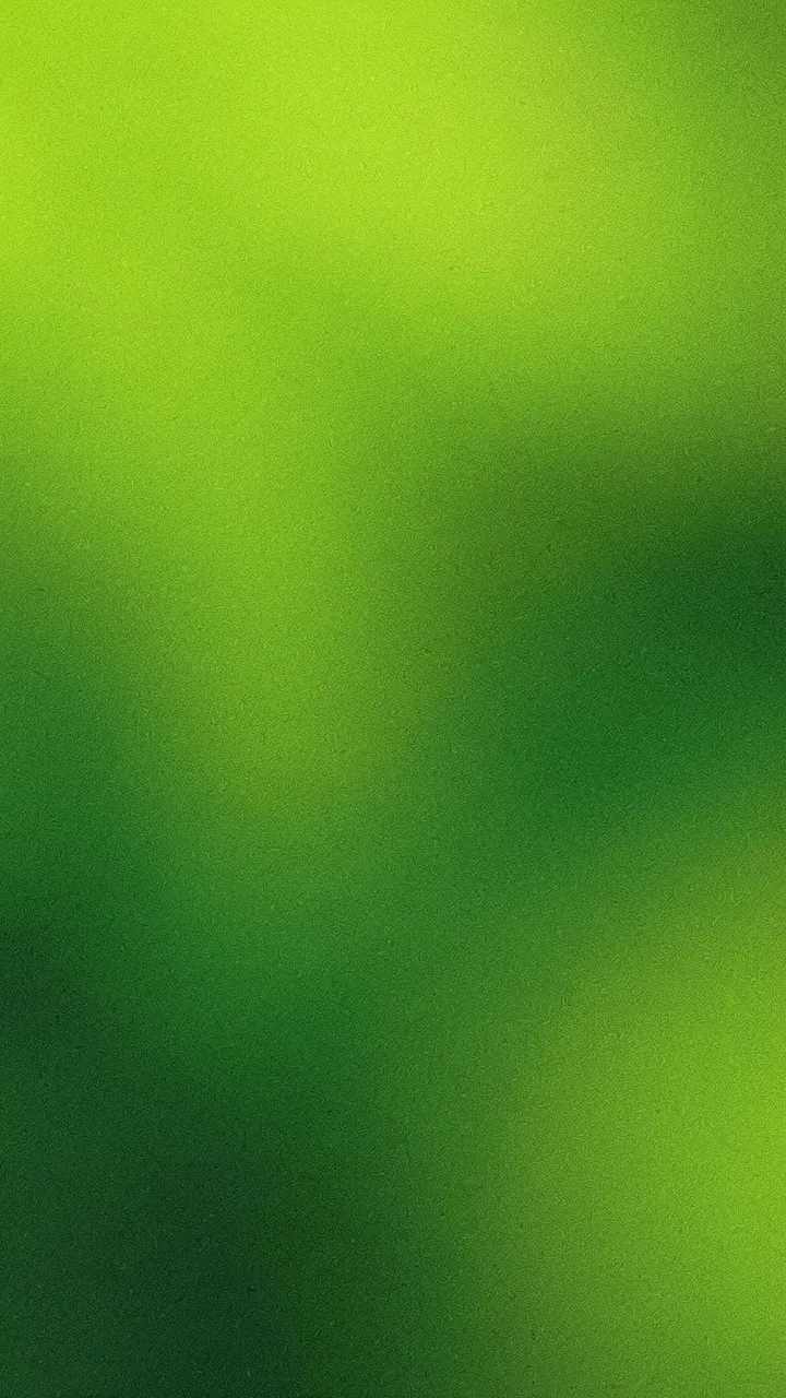 A vertical grainy gradient wallpaper shifting between bright lime and deep forest green with fine speckled texture