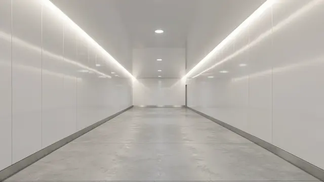 Empty bright minimalist tunnel with glossy white walls, recessed linear lighting, and a smooth concrete floor