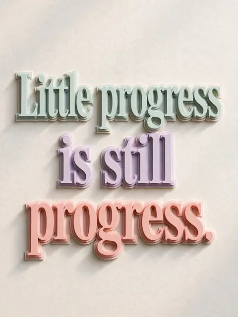 Layered pastel paper cut-out lettering reading "Little progress is still progress." casts soft shadows on a pale textured