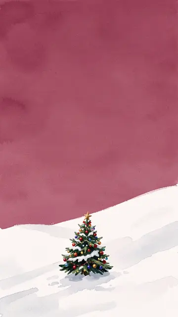 A small decorated snow-dusted Christmas tree sits on a snowy hillside under a dusky pink sky