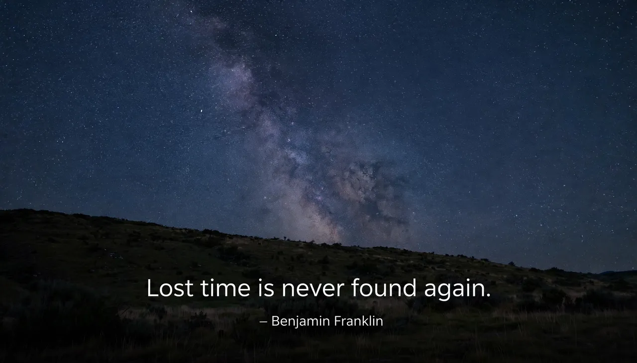 Starry night sky over a dark hill with the quote "Lost time is never found again. — Benjamin Franklin"