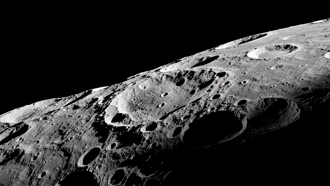 Rugged cratered lunar surface lit by sharp side light along the day-night terminator against black space