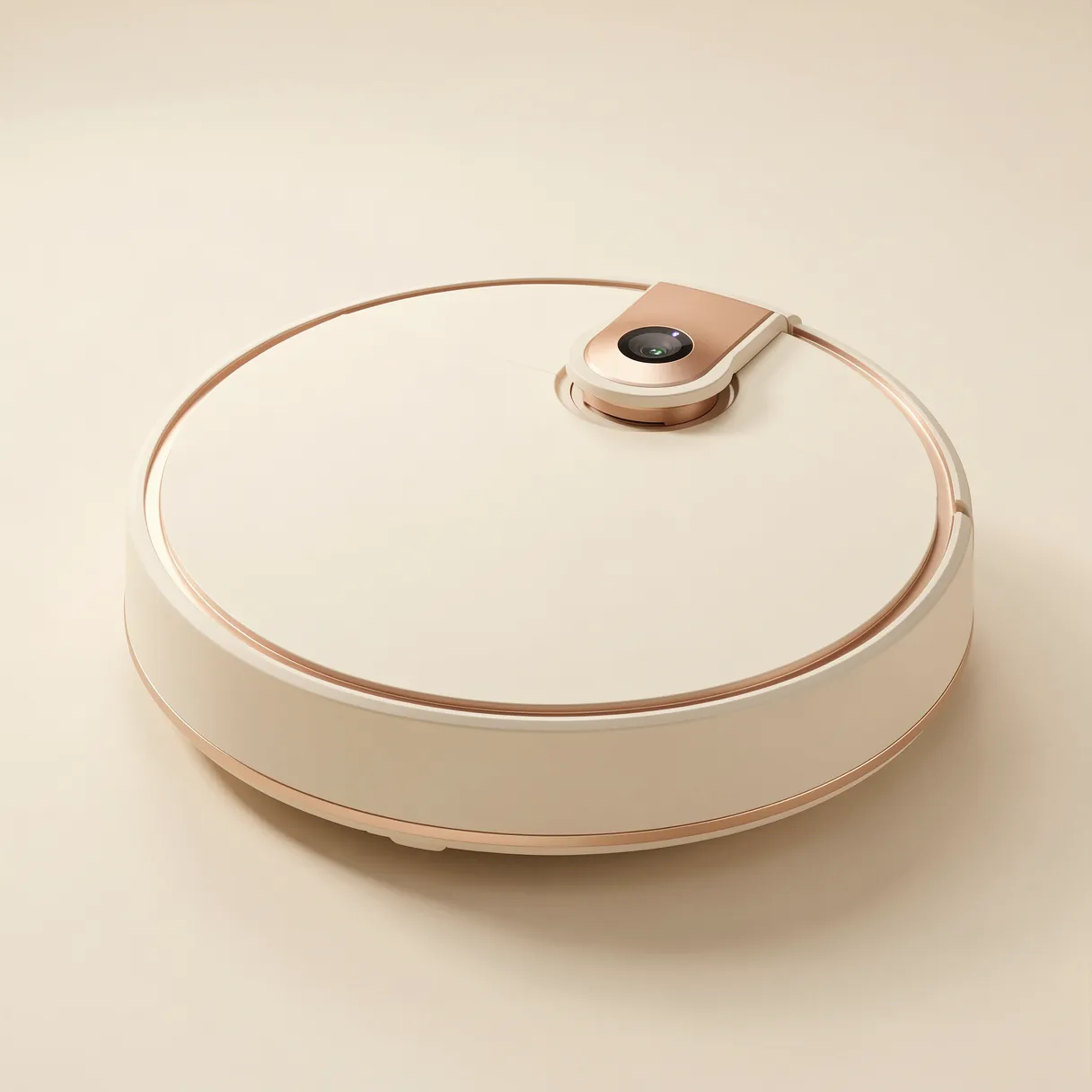 Sleek matte ivory robot vacuum with copper trim rests on a seamless warm off-white studio background