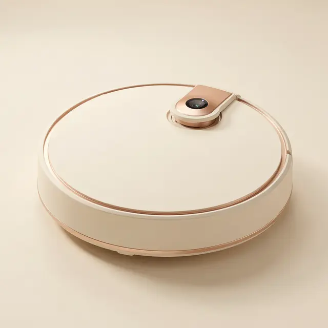 Sleek matte ivory robot vacuum with copper trim rests on a seamless warm off-white studio background