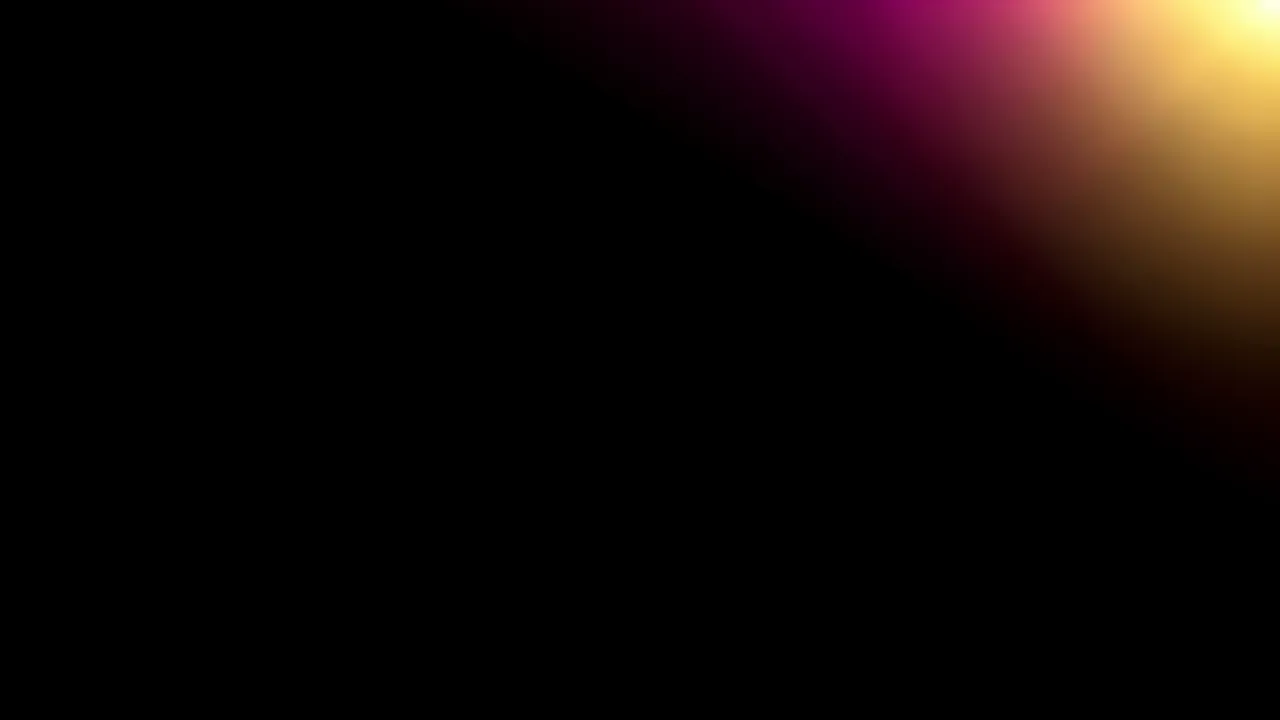 Soft magenta and gold light leak glow appears in the top right corner against a solid black background