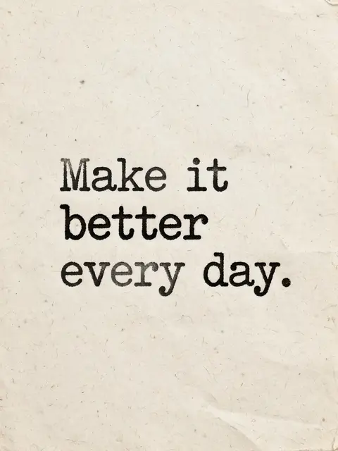 Typewriter-style text reading "Make it better every day." printed on warm textured off-white paper