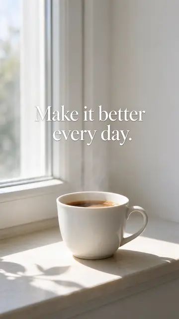 A steaming white coffee cup on a sunny morning windowsill with the text "Make it better every day."