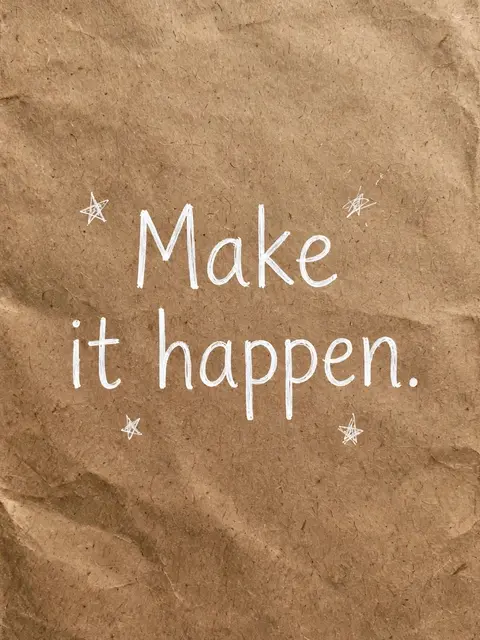 White hand-drawn "Make it happen." lettering with small doodle stars on crumpled brown kraft paper