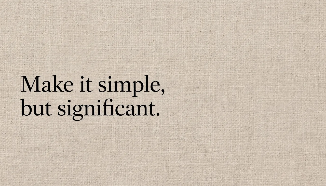 Black serif quote "Make it simple, but significant." set left on a warm beige linen textured desktop wallpaper.