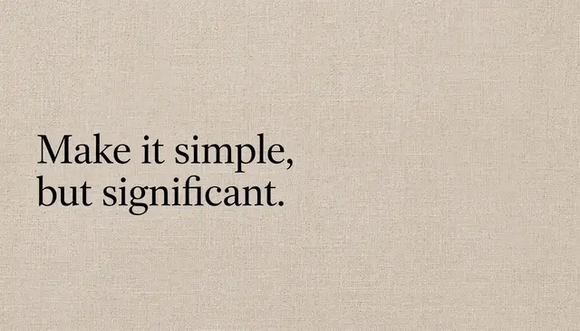 Black serif quote "Make it simple, but significant." set left on a warm beige linen textured desktop wallpaper.