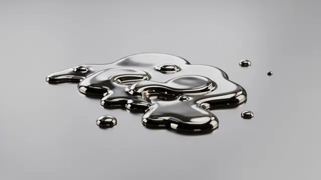 Glossy liquid mercury droplets merge across a smooth reflective gray mirror surface