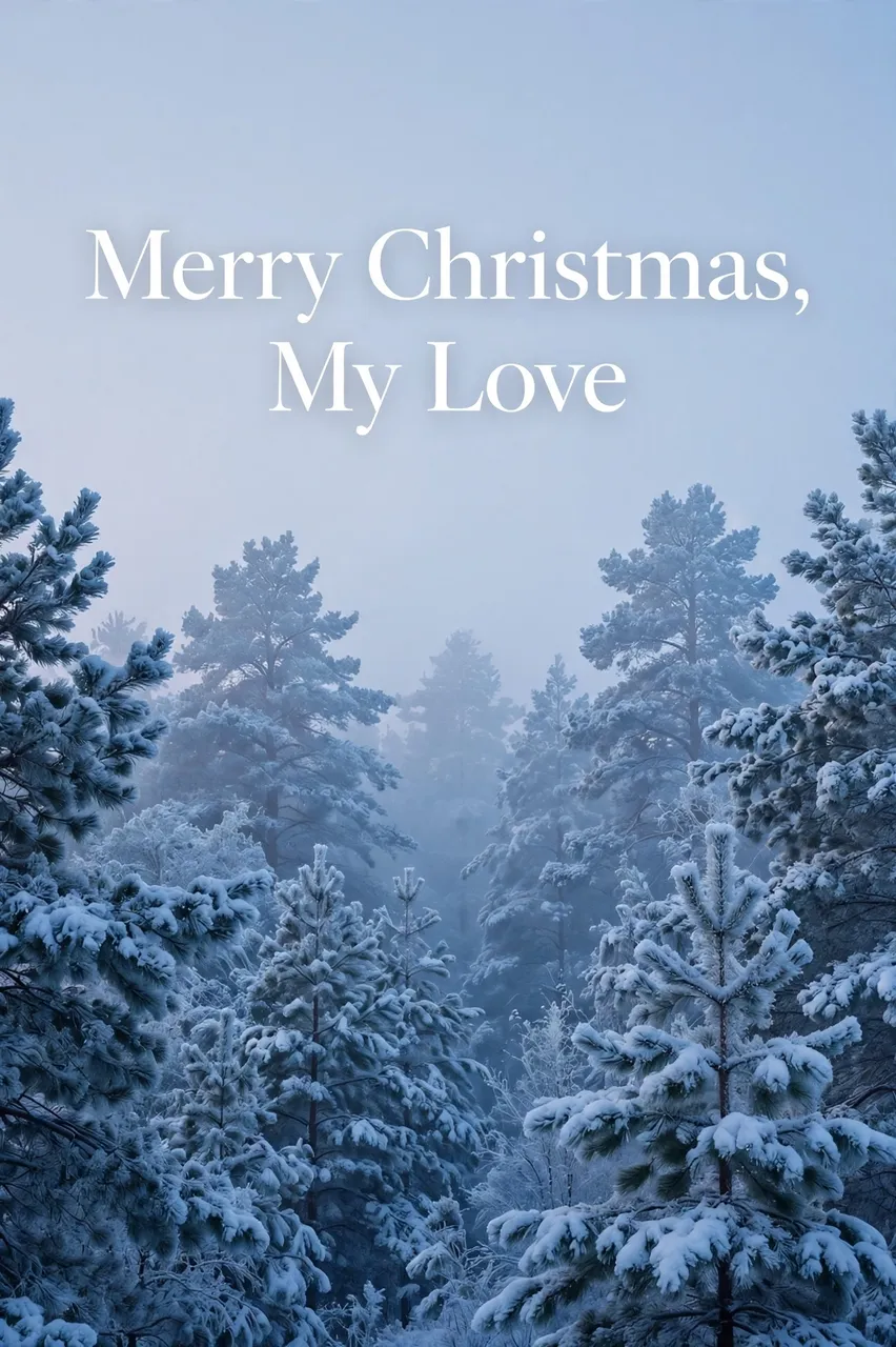 Soft blue foggy winter forest of snow covered pine trees with white text reading "Merry Christmas, My Love"