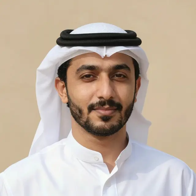 Headshot portrait of a thirties Middle Eastern man in traditional Gulf attire against a sand backdrop