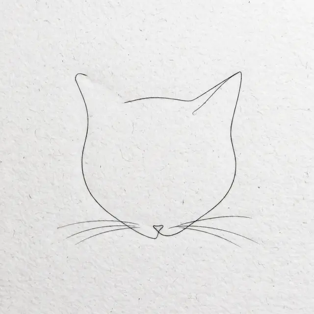 Delicate single line drawing of a cat head silhouette on textured white paper