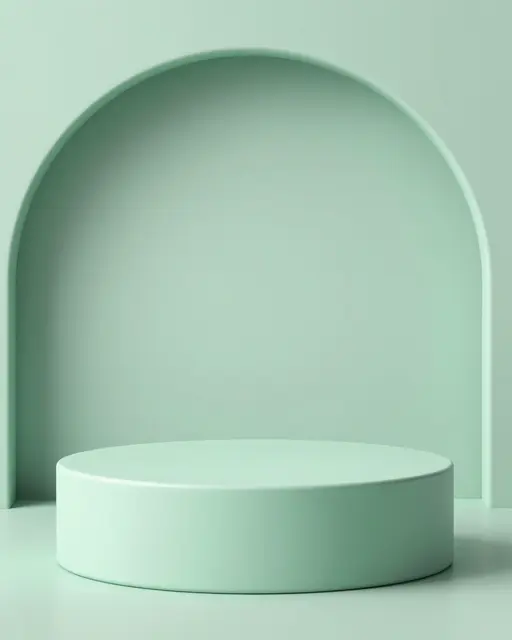 A smooth mint green cylindrical display podium sits in front of a matching arched mint studio backdrop with soft shadows.