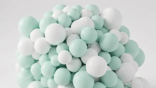 A dense clustered grouping of soft foam-like spheres in pale mint and white against a light gray background